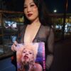 Coco Ono with Pandemic Peep Show book